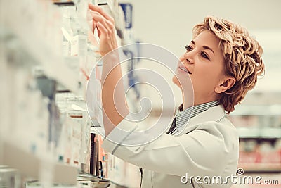 Beautiful pharmacist at work Stock Photo