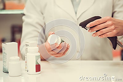 Beautiful pharmacist at work Stock Photo