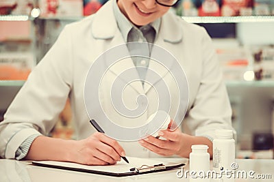 Beautiful pharmacist at work Stock Photo