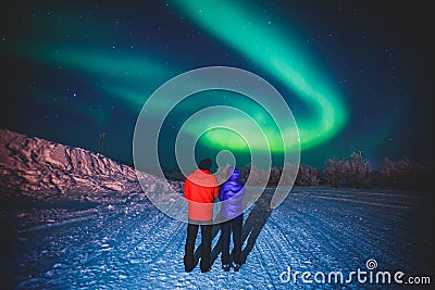 Beautiful picture of massive multicolored green vibrant Aurora Borealis, also known as Northern Lights, Sweden, Lapland Stock Photo