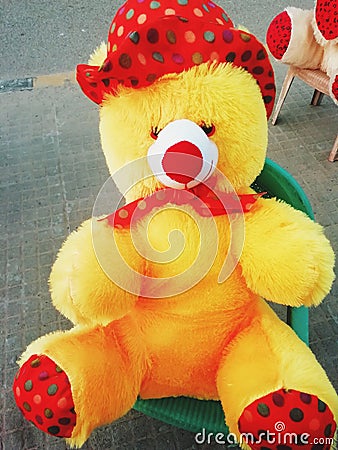 A beautiful picture of taddy bear at a chair Stock Photo