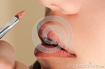 Beautiful pink gloss on lips Stock Photo