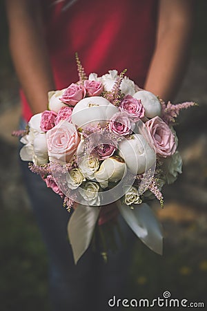 Beautiful pink and white wedding bouquet with roses and paeonies, wedding celebration and valentines daybeautiful pink and white w Stock Photo