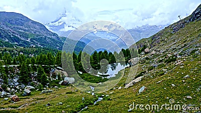 Beautiful places in Switzerland. Lake in the mountains. Untouched nature. The sky in the mountains. Stock Photo