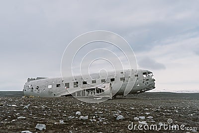 Beautiful plane crash on the black beaches. Moody clouds in the background. Stunning Iceland landscape photography. Stock Photo