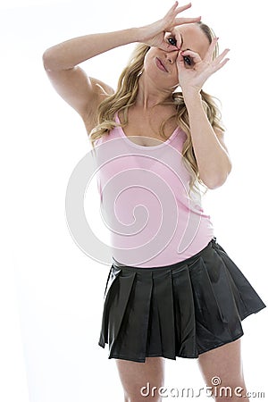 Beautiful Playful Young Caucasian Woman Looking Through Her Fingers in Fun Stock Photo