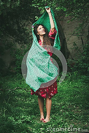 Beautiful playfull young woman in garden Stock Photo