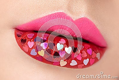 Beautiful plump pink lips with pasted hearts Stock Photo