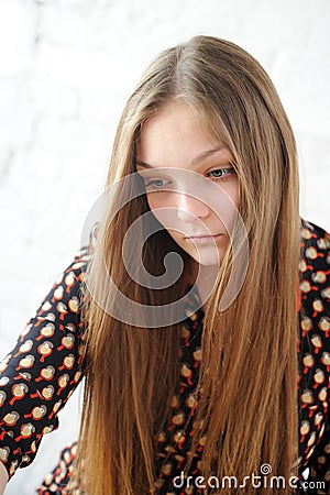 Beautiful plump teen girl with long hair Stock Photo