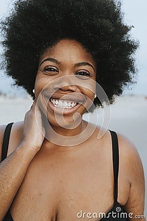 Beautiful plus size African American woman at the beach Stock Photo