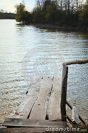 Wooden ladder, wooden bridge, Pond river pond nature sky in reflection. reflections in water, Lake View Stock Photo