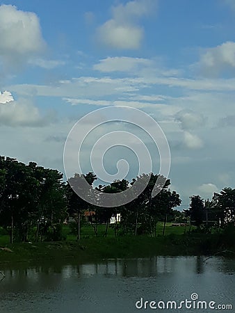 Beautiful pond and trees and cloud Stock Photo