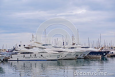 Beautiful port of Alicante, Spain Luxury yachts, ships, fishing boats sailing and standing in rows in harbor Editorial Stock Photo