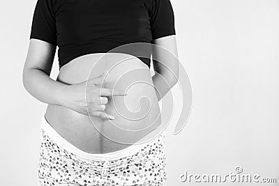 beautiful portrait of black and white pregnant lady with hand love sign Stock Photo