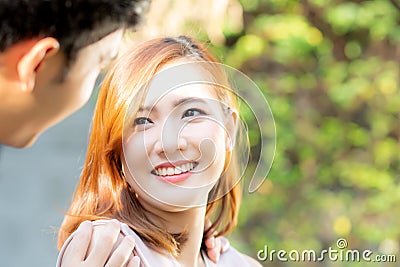 Beautiful portrait couple looking each others eyes and smiling with happy, young asian man and woman relation with love dating Stock Photo