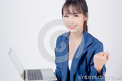 Beautiful portrait young asian business woman smiling and cheerful holding laptop computer isolated Editorial Stock Photo