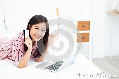 Beautiful of portrait young asian woman lying users credit card Editorial Stock Photo