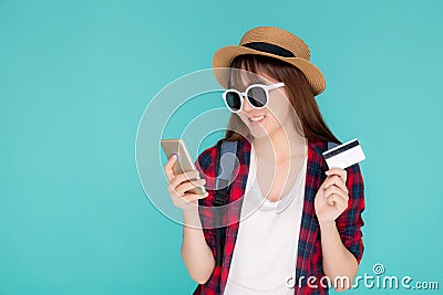 Beautiful portrait young asian woman wear travel summer fashion holding credit card and smart mobile phone in summer Stock Photo