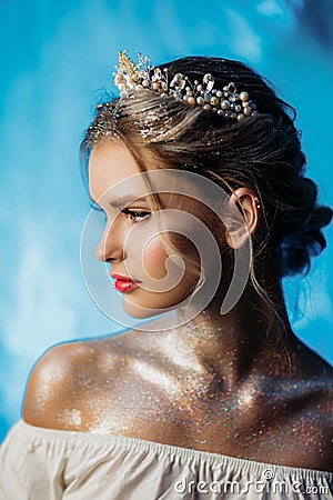 Beautiful portrait of a young girl. The image of a snow queen with a crown on his head Stock Photo