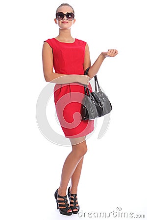 Beautiful posh young woman in short red dress Stock Photo