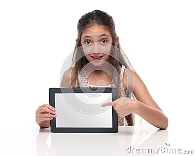 Beautiful pre-teen girl showing a tablet computer. Stock Photo