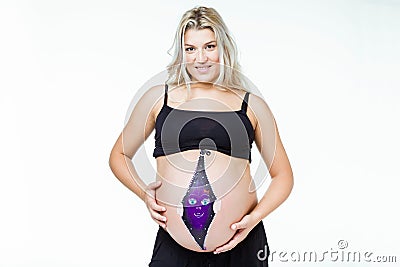 Beautiful pregnant woman with baby painted on belly. Stock Photo