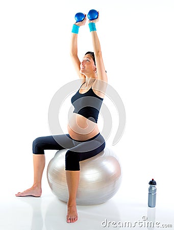 Beautiful pregnant woman at fitness gym Stock Photo