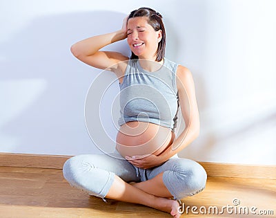 Beautiful pregnant woman headache pain expression Stock Photo