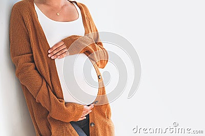 Close-up pregnant woman touching her belly. Mother anticipation Stock Photo