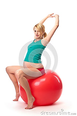 Beautiful pregnant woman using gym ball Stock Photo