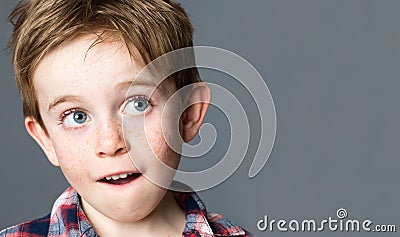 Beautiful preschool kid looking up to daydream and imagine Stock Photo