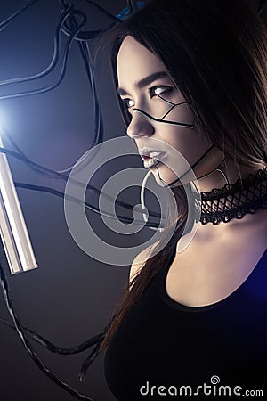 Beautiful profile face robot girl in style cyberpunk with wires Stock Photo