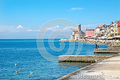 Beautiful promenade in Piran with colorful old houses, Slovakia, Europe Editorial Stock Photo