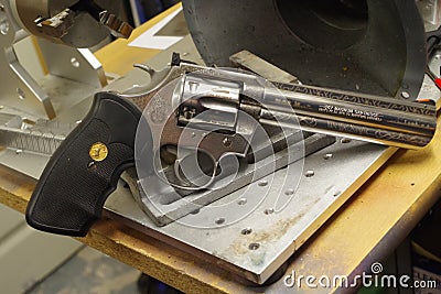 Colt Python 357 on a work bench ready for engraving. Editorial Stock Photo