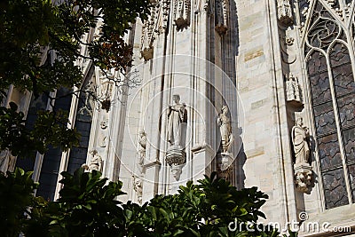 Beautiful ragment of the cathedral against the blue sky in Milan in Italy in summer Stock Photo