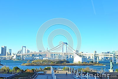 Rainbow bridge that connects Odaiba and mainland Tokyo across Tokyo Bay Editorial Stock Photo