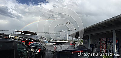 A beautiful rainbow and cars Editorial Stock Photo