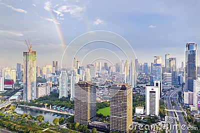 Beautiful rainbow on the Jakarta city sky Editorial Stock Photo
