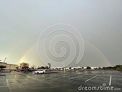 Beautiful rainbow over empty parking lot Editorial Stock Photo