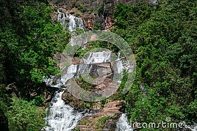 Beautiful Rawana Ella waterfall, surrounded by green tropical forest Stock Photo