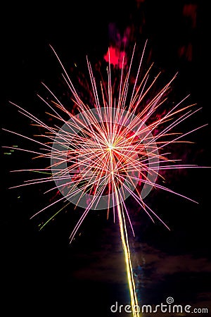 A Red Fireworks Burst in the Sky Stock Photo