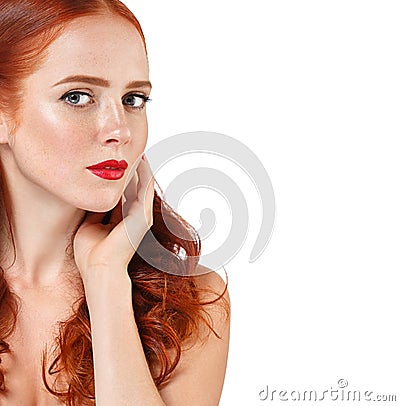 Beautiful red hair woman portrait with flower in hair perfect make up manicure Stock Photo