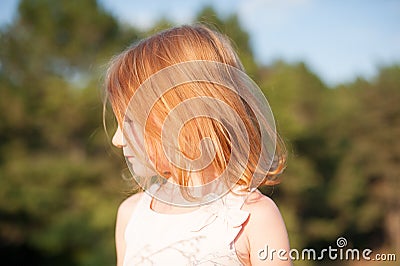 Red-haired girl in profile Stock Photo