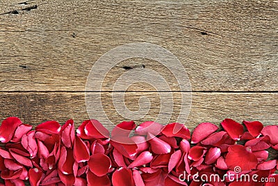Beautiful red roses petals on wooden. Valentine's Day, anniversary etc background. Stock Photo