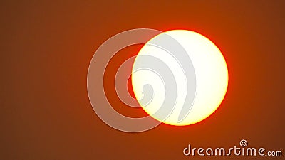 Beautiful red sky behind the sun Stock Photo