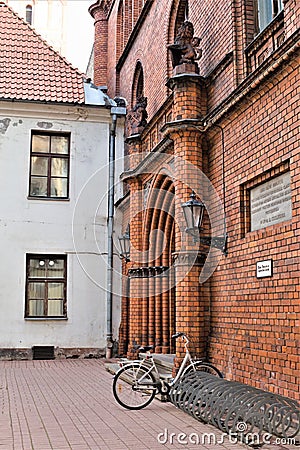 Riga, Latvia, November 2019. Bicycle parking at the wall of an old medieval temple. Editorial Stock Photo