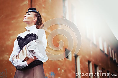 Beautiful redhair woman in vintage clothes Stock Photo