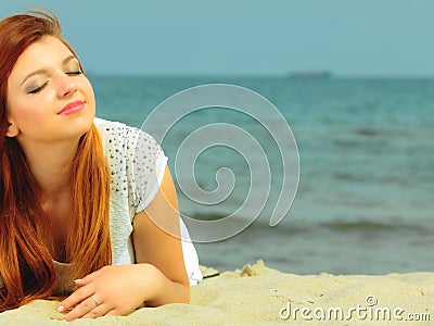 Beautiful redhaired girl on beach, portrait Stock Photo