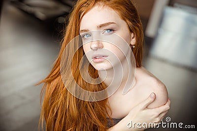 Beautiful redhead woman looking at camera Stock Photo