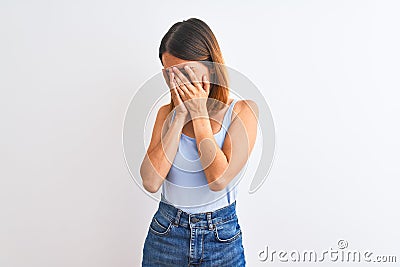 Beautiful redhead woman standing over isolated background with sad expression covering face with hands while crying Stock Photo
